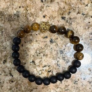 Black and Brown Beaded Bracelet with Gold Lion Charm